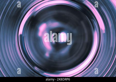 Abstrakte rosa und violette Kreislichtwege Stockfoto