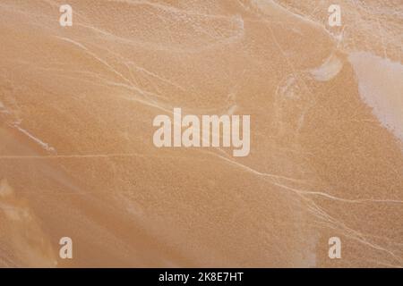 Honey Onyx Textur, Hintergrund in beige Farbe für Home Design. Slabfoto. Matt Luxus Stein Muster, Hintergrund für äußere Hausdekoration, Boden Stockfoto