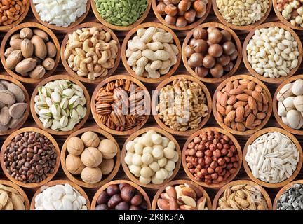 Sammlung von Nüssen und Samen Hintergrund, gesunde Snacks für Lebensmittel. Stockfoto