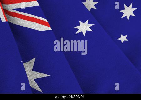 Australien Flagge mit großen Falten winken aus nächster Nähe unter dem Studiolicht im Innenbereich. Die offiziellen Symbole und Farben in Stoff Banner Stockfoto