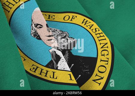US-Staatsflagge von Washington mit großen Falten, die in Innenräumen unter dem Studiolicht winken. Die offiziellen Symbole und Farben in Stoff Banner Stockfoto