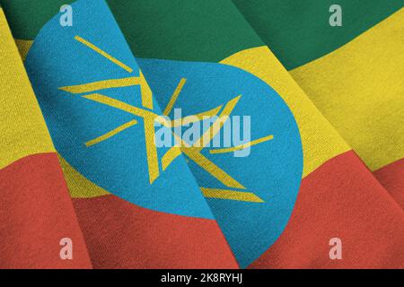 Äthiopien Flagge mit großen Falten winken aus nächster Nähe unter dem Studiolicht drinnen. Die offiziellen Symbole und Farben in Stoff Banner Stockfoto