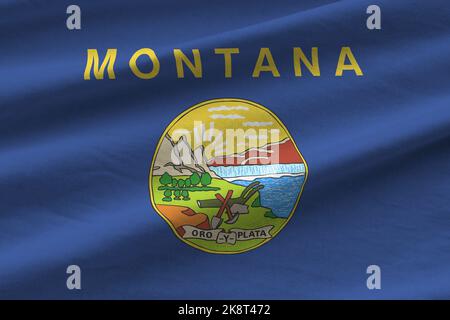 US-Staatsflagge von Montana mit großen Falten, die in Innenräumen unter dem Studiolicht winken. Die offiziellen Symbole und Farben in Stoff Banner Stockfoto