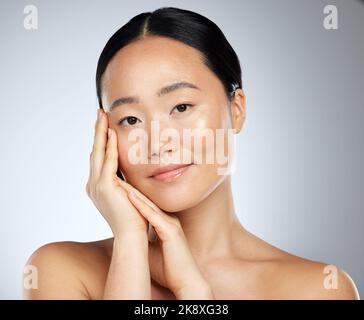 Beauty brand, skincare and dermatology treatment with woman using asian product routine for clean and healthy face and skin. Portrait of happy female Stockfoto