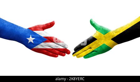 Handschlag zwischen Jamaika und Puerto Rico Fahnen auf Händen gemalt, isolierte transparente Bild. Stockfoto
