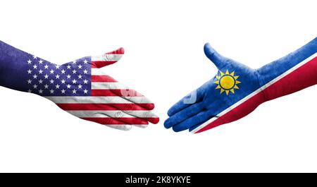 Handschlag zwischen Namibia und USA Flaggen auf Händen gemalt, isoliertes transparentes Bild. Stockfoto
