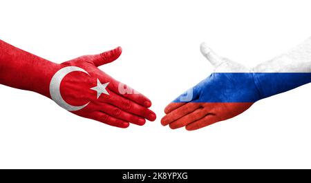 Handschlag zwischen Russland und der Türkei Flaggen auf Händen gemalt, isolierte transparente Bild. Stockfoto