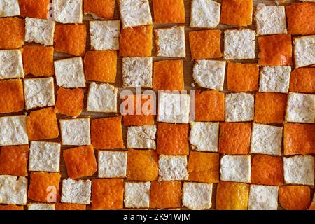 Hintergrund mit Orangenschalen-Quadraten Stockfoto