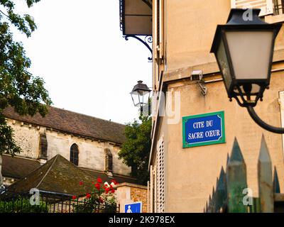 Paris Frankreich - Juni 21 2009; Zeichen an der Wand Religiöse Wörter Cite du Sacre Coeur Bedeutung Zitat oder Erwähnung des Heiligen Herzens, Montmatre, Frankreich. Stockfoto