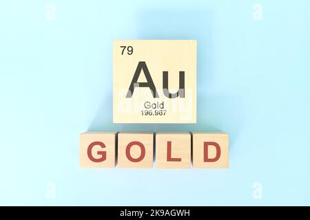 Goldenes chemisches Elementsymbol mit atomarer Masse und atomarer Zahl in Holzblöcken flacher Laienzusammensetzung. Chemie und Wissenschaft Konzept. Stockfoto