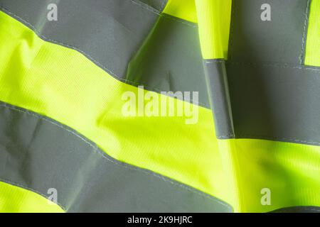 Reflektierende Weste Nahaufnahme als Hintergrund, sorgfältig, arbeiten Uniform Stockfoto