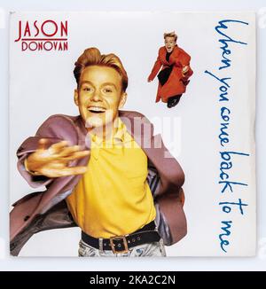 Sieben Zoll großes Vinyl-Cover der Single When You Come Back To Me von Jason Donovan, die 1989 veröffentlicht wurde Stockfoto