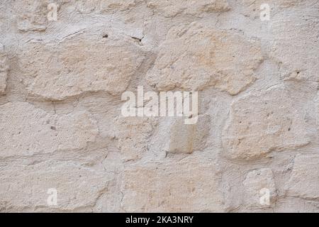 Detaillierte strukturierte Hintergrund von Sandstein alten Wand mit Blöcken hellgelb gefärbt Stockfoto