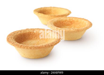 Gruppe leerer Tartlets, Tart Shells, isoliert auf weißem Hintergrund Stockfoto