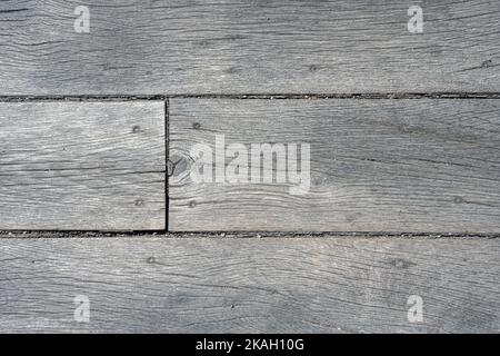Hintergrund einer Wand aus Holzbohlen Stockfoto
