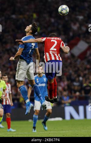 Jose Maria Gimenez von Atletico de Madrid und Cristiano Ronaldo von Juventus während des UEFA Champions League-Spiels zwischen Atletico de Madrid und Juventus im Wanda Metropolitano Stadium in Madrid, Spanien. 18. September 2019. (Foto von A. Ware/NurPhoto) Stockfoto