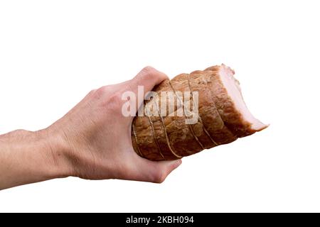 Isoliert auf weißem Hintergrund Schinken in den Händen des Menschen Stockfoto
