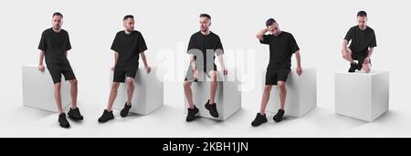 Schwarzer Mockup Herrenanzug übergroßes T-Shirt auf Shorts auf Mann auf Würfel. Bekleidungsvorlage für Präsentationen von Design, Druck, Muster. Eingestellt Stockfoto