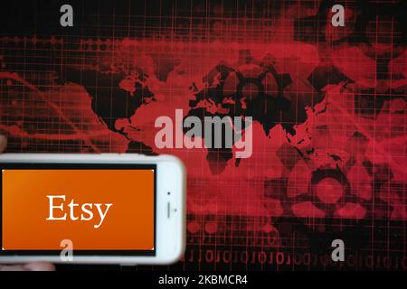 Das Logo der E-Commerce-Website Etsy ist auf einem Bildschirm eines Telefons neben einer roten Abbildung der Welt- und Finanzmärkte in Frankfurt am 14. April 2020 zu sehen. Es ist eines der Unternehmen, das am meisten von der Sperre profitieren könnte. (Fotoillustration von Alexander Pohl/NurPhoto)