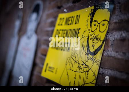 Menschen nehmen an einer Demonstration zur Freilassung von Patrick Zaki in Rom, Italien, am 07. Dezember 2021 Teil. Ein ägyptisches Gericht ordnete die Freilassung von Patrick Zaki aus dem Gefängnis an, bis sein Prozess am 01. Februar 2022 anhängig war. Zaki, ein ägyptischer Student der IT-Abteilung und Forscher an der Universität Bologna, wurde bei seiner Ankunft im Februar auf den internationalen Flughafen von Kairo verhaftet, als er von Italien nach Ägypten zurückkehrte, um dort eine Familie zu besuchen. (Foto von Andrea Ronchini/NurPhoto) Stockfoto