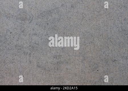 Top-Down-Schuss auf glatte graue Pflaster-Textur Stockfoto