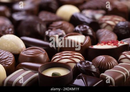 Set von Schokolade Bonbons Hintergrund, süße Dessert Praline Stockfoto