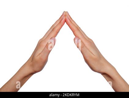 Weibliche Hände gefaltet in Form des Daches des Hauses isoliert auf weiß. Stockfoto