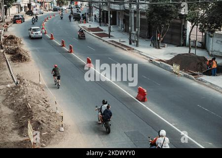 Aktivitäten am Morgen in einer Straße in Malang, Ost-Java, Indonesien Stockfoto