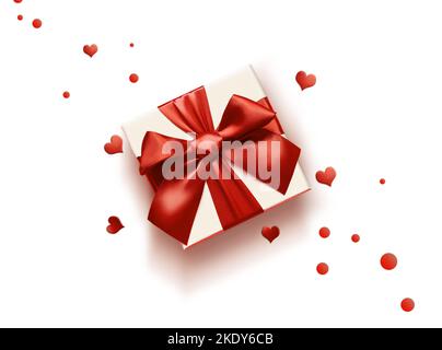 Draufsicht Foto von valentinstag Dekorationen weiße Geschenkbox mit rotem Band Schleife und kleinen Herzen auf isoliertem weißen Hintergrund mit leerem Raum. Stockfoto
