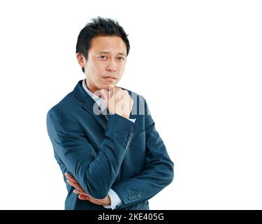 Sie könnten auf etwas sein...Studioporträt eines hübschen jungen Geschäftsmannes, der vor einem weißen Hintergrund posiert. Stockfoto