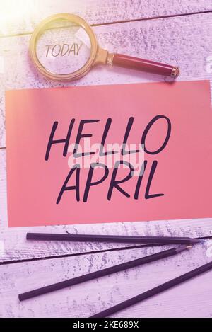 Textschild mit der Meldung „Hallo April“. Wort für einen Grußausdruck, der bei der Begrüßung des Monats April verwendet wird Stockfoto