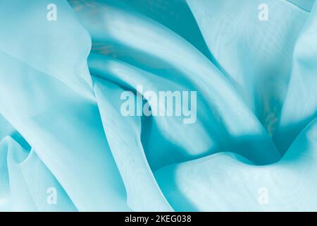 Blaue Seidenqualität. Gewellte Stoffstruktur Stockfoto