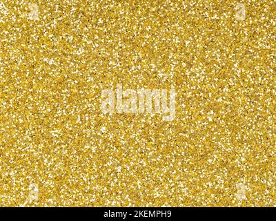 Goldener Glitzer. Perfekter holographischer Hintergrund oder Muster aus funkelndem Glitter zur Dekoration und Gestaltung von Weihnachten, Neujahr, Valentinstag Stockfoto