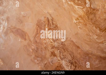 Rötlicher Marmorhintergrund mit vielen Adern, Vektormarmorstruktur Stockfoto