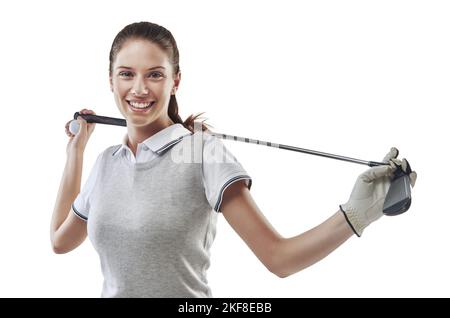 Sind Sie bereit für eine weitere Runde. Studioaufnahme einer jungen Golferin, die einen Golfschläger hinter ihrem Rücken in Weiß gehalten hat. Stockfoto