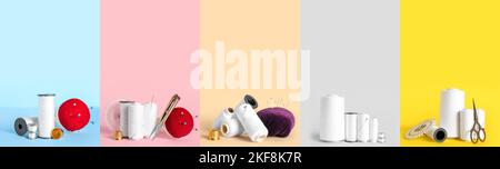 Kollektion von weißen Garnspulen mit Nähzubehör auf farbigem Hintergrund Stockfoto