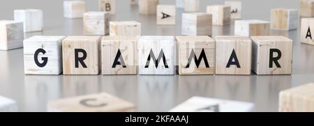 Grammatik - Wort auf Holzblöcken - 3D Illustration Stockfoto