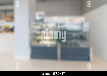 Abstrakte Unschärfe und Unschärfe-Einkaufszentrum im Inneren des Kaufhauses für den Hintergrund. Wände des Ladens moderner Vintage Loft in grauem Stil. Perfekt für Stockfoto
