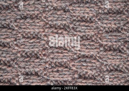 Bio-Strickstruktur mit detailgestrickenen Wollfäden. Stockfoto