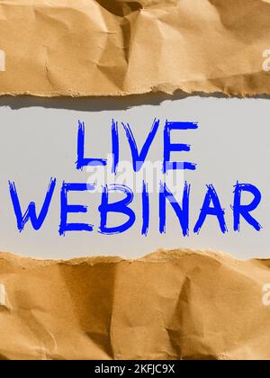 Handschriftliches Schild Live Webinar. Business Showcase Interaktives Seminar, das über das Internet in Echtzeit übertragen wird Stockfoto