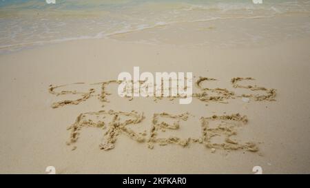 Stressfreie Zone Geschrieben Auf Sand Am Meer Am Strand Stockfoto