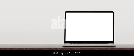 Laptop auf Holztisch, graue Wand. Laptop leerer Bildschirm mockup auf Holztisch. Vorderansicht Laptop auf Arbeitstisch, weißer Hintergrund Stockfoto