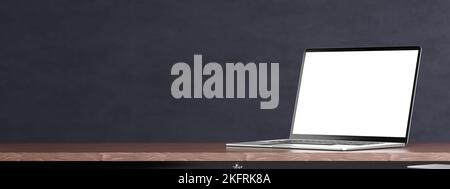 Laptop-Modell auf Tisch, grauer Wandhintergrund. Laptop mit leerem weißen Bildschirm-Modell auf Holztisch. Laptop mit Seitenansicht, breites Bild, Kopierbereich. 3D Abb. Stockfoto