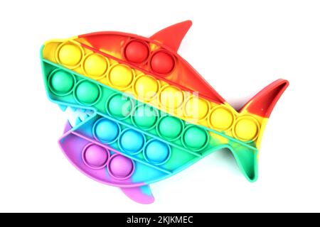 Drücken Sie das Pop-it-Bubble-Fidget-Sinnesspielzeug in Regenbogenfarben abstrakter Hintergrund- und Textur Stockfoto