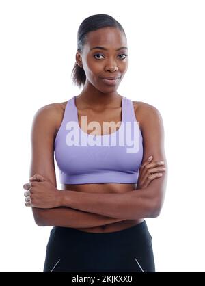 Ja, ich bin gesund... Du bist es. Ein Porträt einer schönen jungen Frau in Sportbekleidung, isoliert auf Weiß. Stockfoto