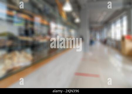 Abstrakte Unschärfe und Unschärfe-Einkaufszentrum im Inneren des Kaufhauses für den Hintergrund. Wände des Ladens moderner Vintage Loft in grauem Stil. Perfekt für Stockfoto