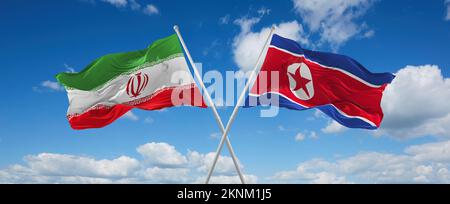 Zwei gekreuzte Flaggen Nordkorea und Iran, die im Wind am bewölkten Himmel winken. Beziehungskonzept, Dialog, Reisen zwischen zwei Ländern. 3D Illustration Stockfoto