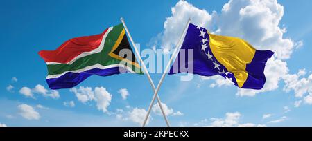 Zwei gekreuzte Flaggen Bosnien und Herzegowina und Südafrika winken im Wind am bewölkten Himmel. Beziehungskonzept, Dialog, Reisen zwischen zwei Zählern Stockfoto