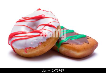 Zwei gebackene, mattierte Donuts, die auf Weiß ausgeschnitten wurden. Stockfoto