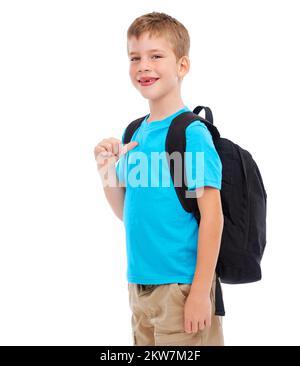 Ich lerne gerne hart. Studiofoto eines legeren Jungen, isoliert auf Weiß. Stockfoto